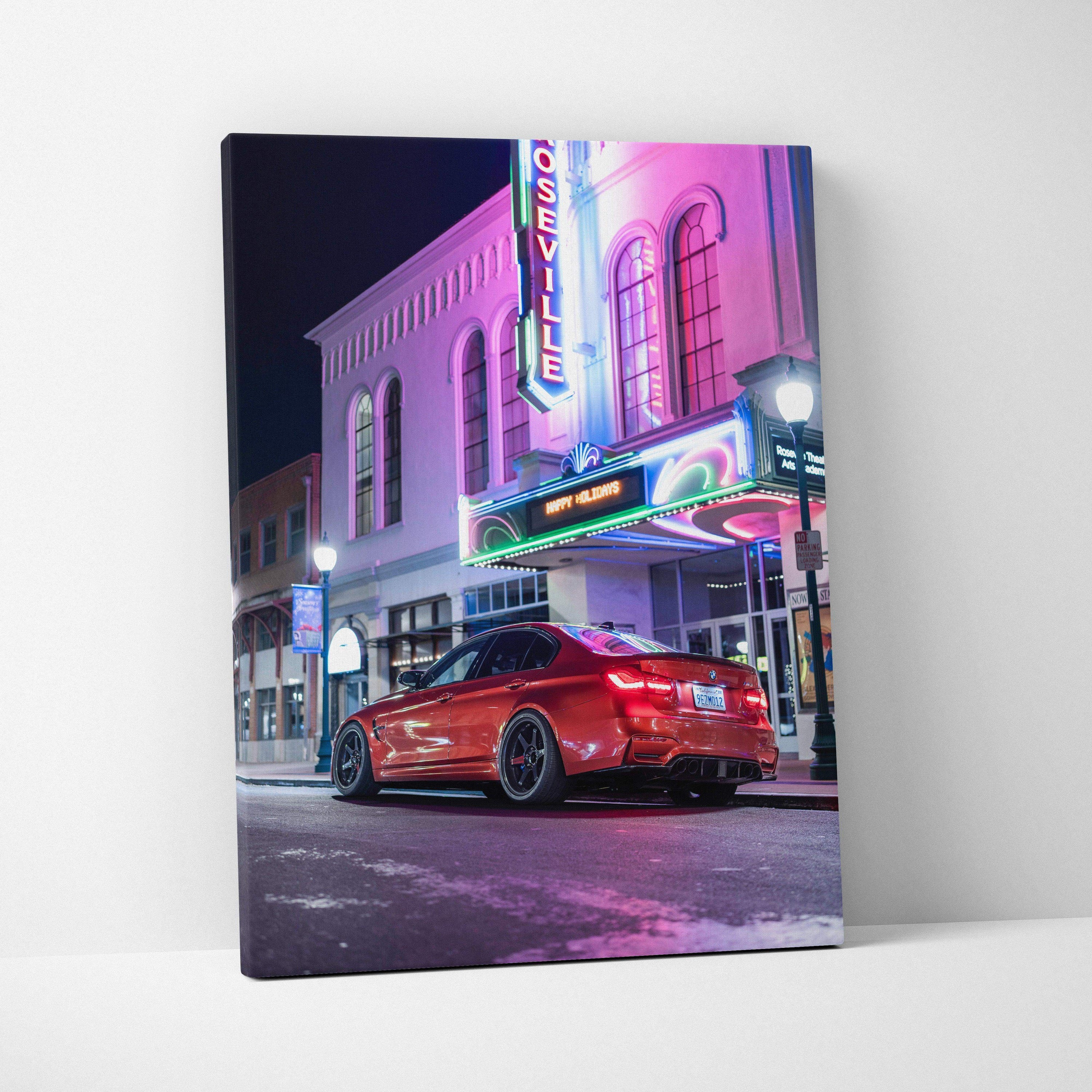 Vertical canvas wall art featuring a red BMW F80 M3 parked under neon lights at night.