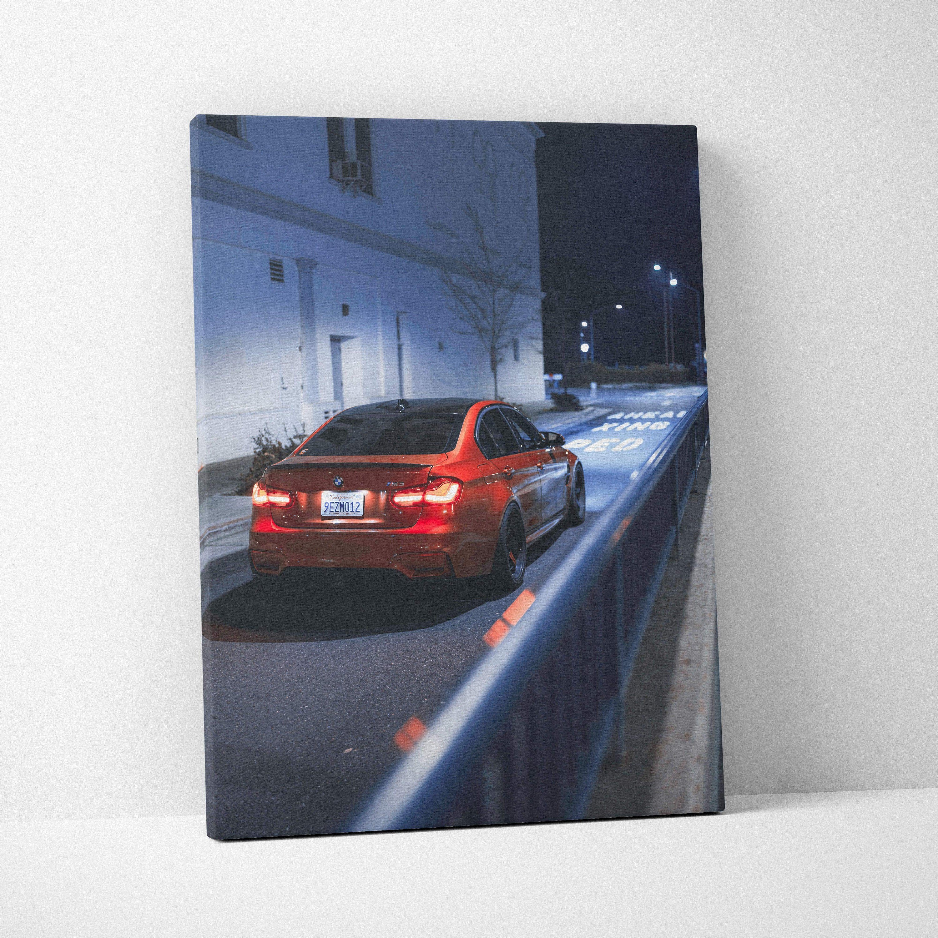 Vertical canvas art featuring a red BMW F80 M3 parked on a dimly lit street at night, modern wall art print.