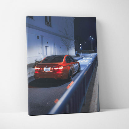 Vertical canvas art featuring a red BMW F80 M3 parked on a dimly lit street at night, modern wall art print.