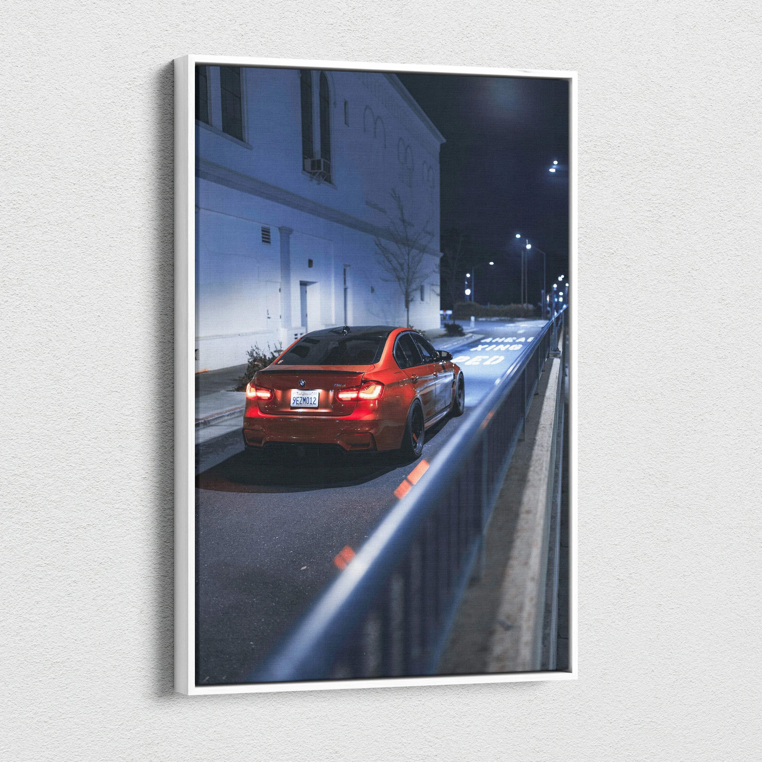 Vertical canvas art featuring a red BMW F80 M3 parked on a dimly lit street at night, high-resolution wall art.