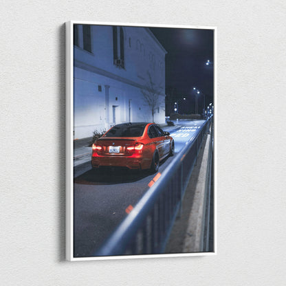 Vertical canvas art featuring a red BMW F80 M3 parked on a dimly lit street at night, high-resolution wall art.