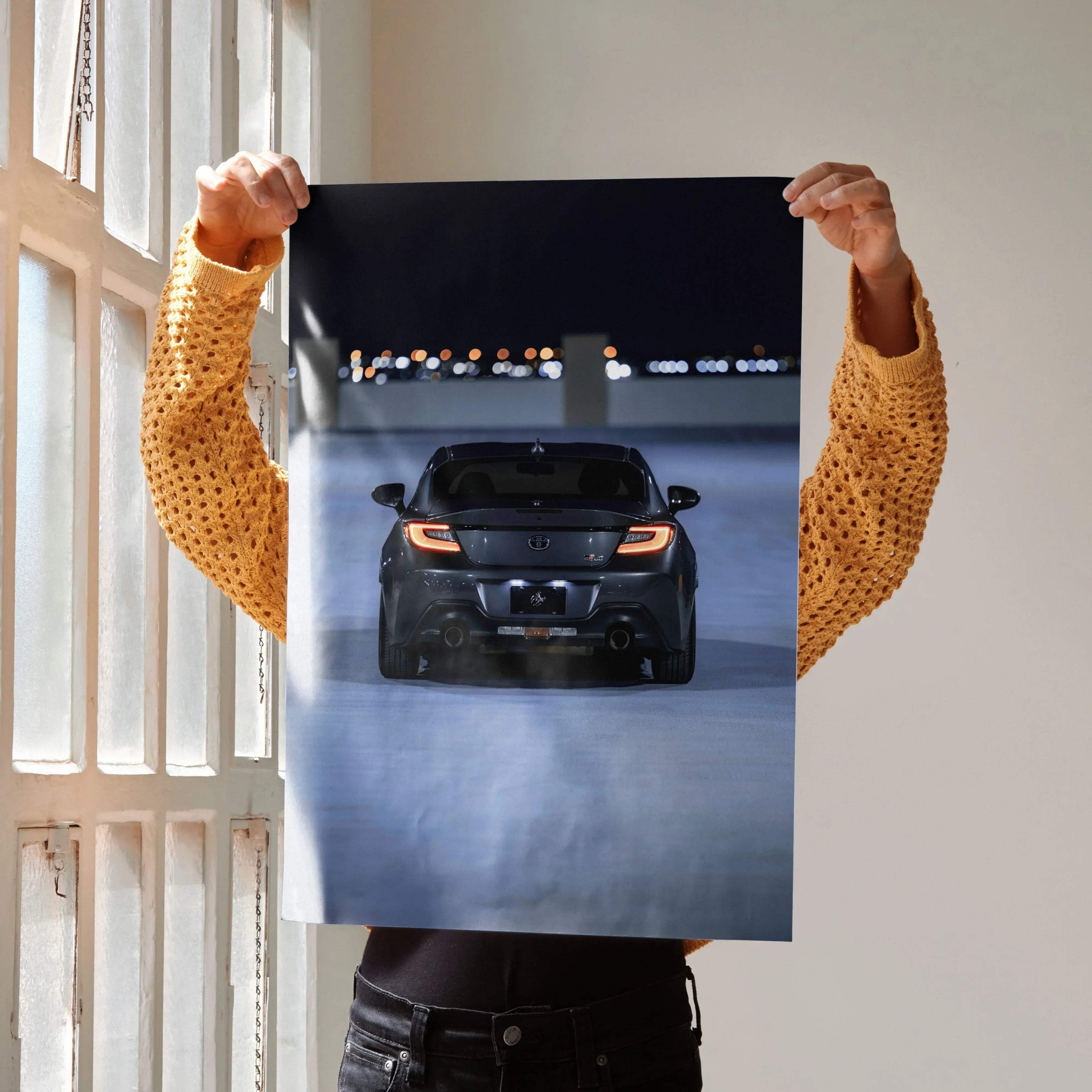 Toyota GR86 rear view at night poster showcasing sleek car taillights, automotive wall art.