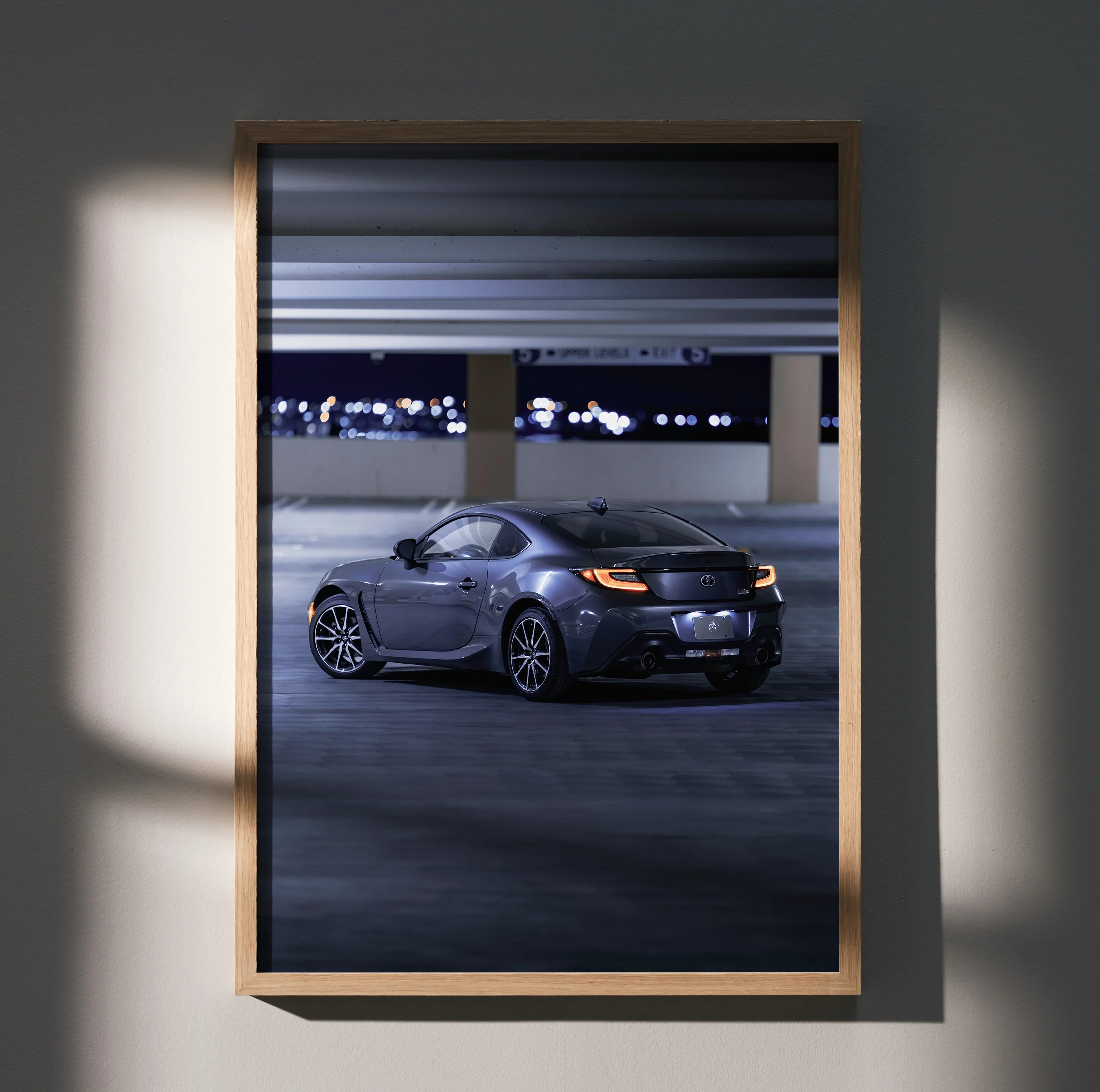Toyota GR86 sports car displayed at night in parking garage poster wall art.