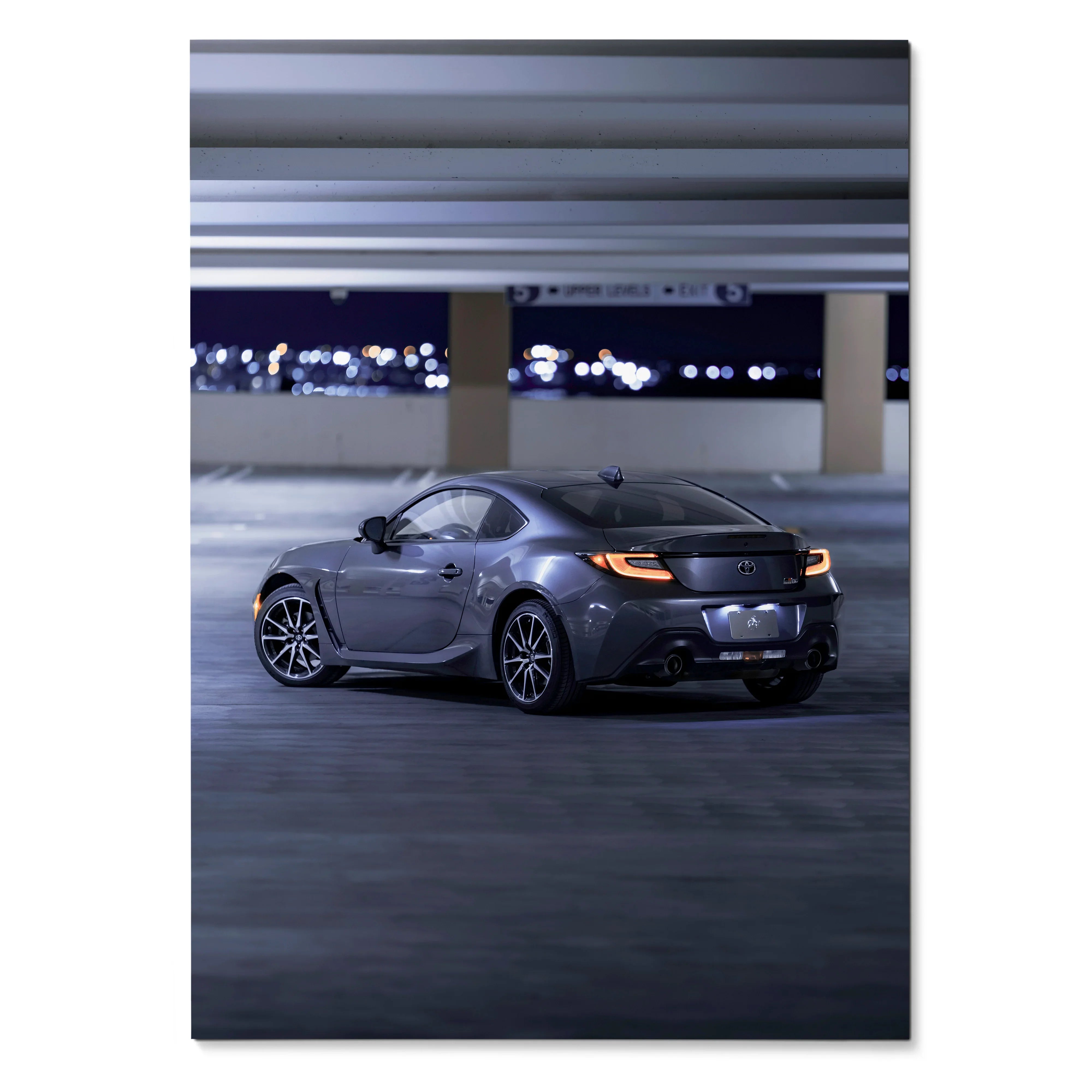 Toyota GR86 sports car in sleek gray, captured at night in urban parking poster wall art.