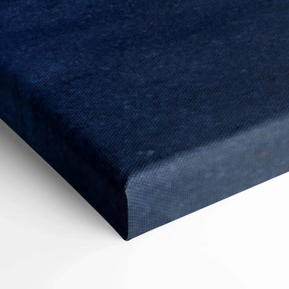 Dark blue textured canvas art stretched on wooden frame for wall art display.