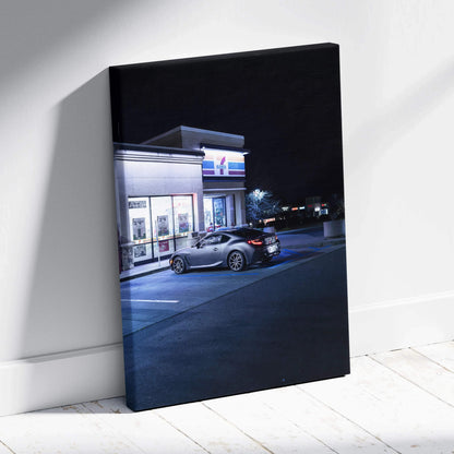 Toyota GR86 parked outside a lit convenience store at night on vertical canvas wall art.