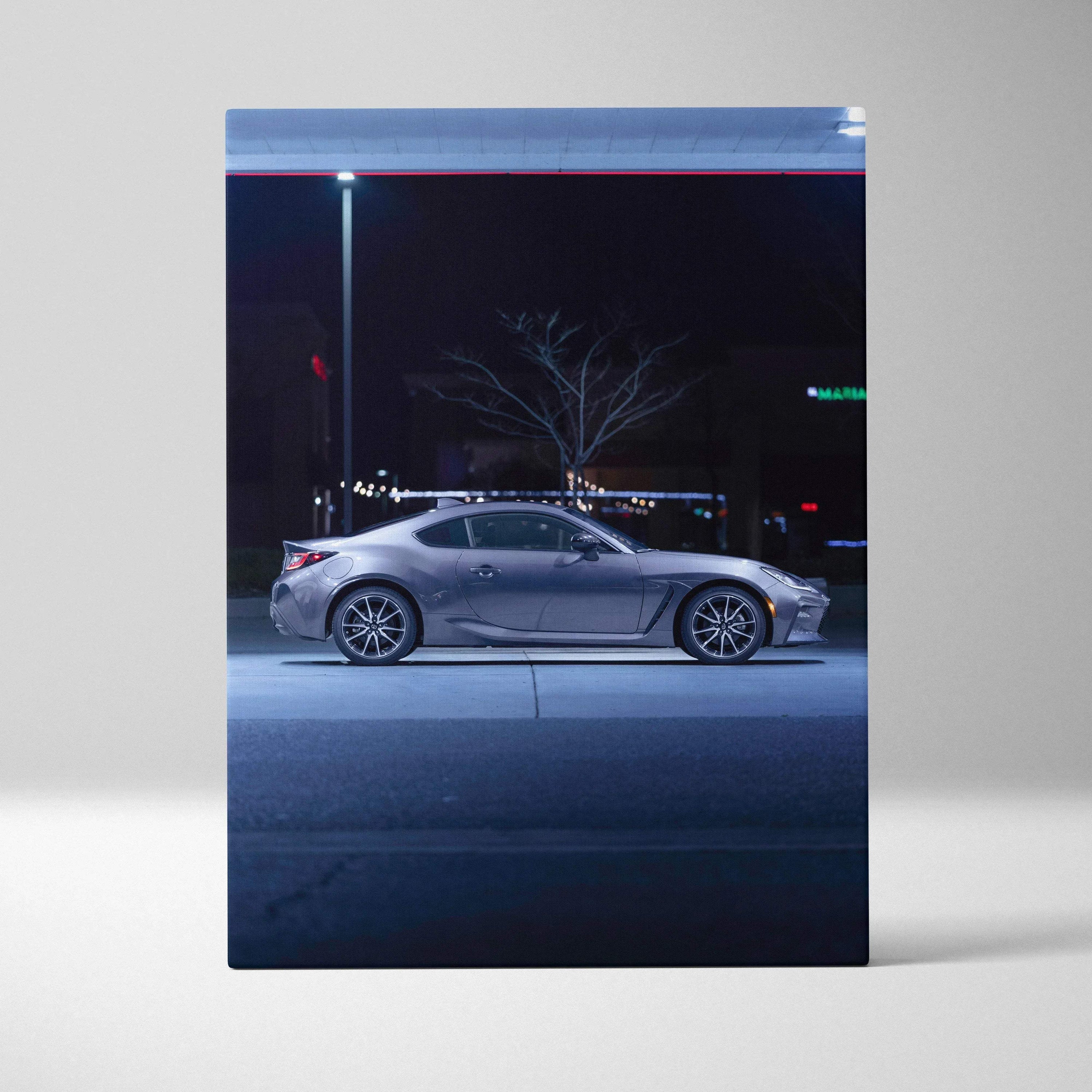 Toyota GR86 parked at night under streetlight canvas wall art in vertical format.