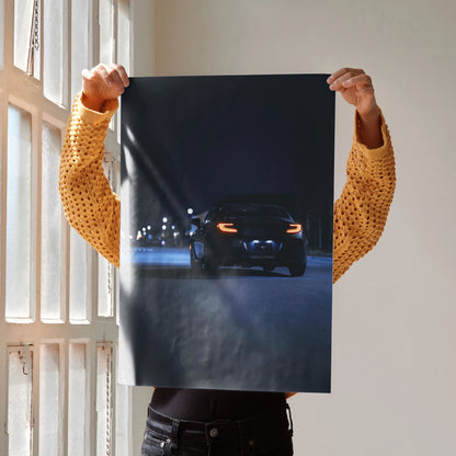 Toyota GR86 poster showing rear view of a car on a dark road at night, automotive wall art.