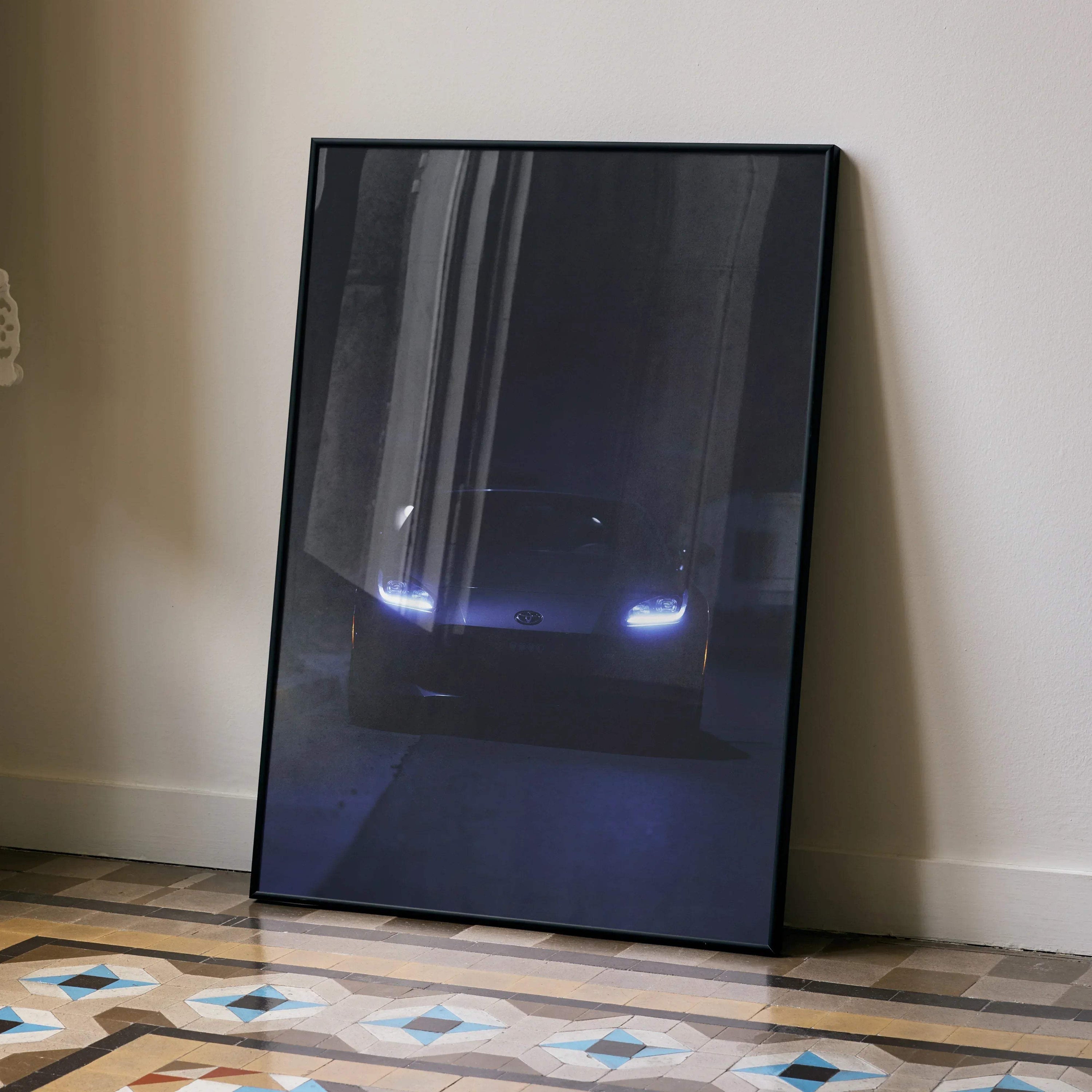 GR86 automotive art poster featuring car headlights glowing in the dark, framed wall art.