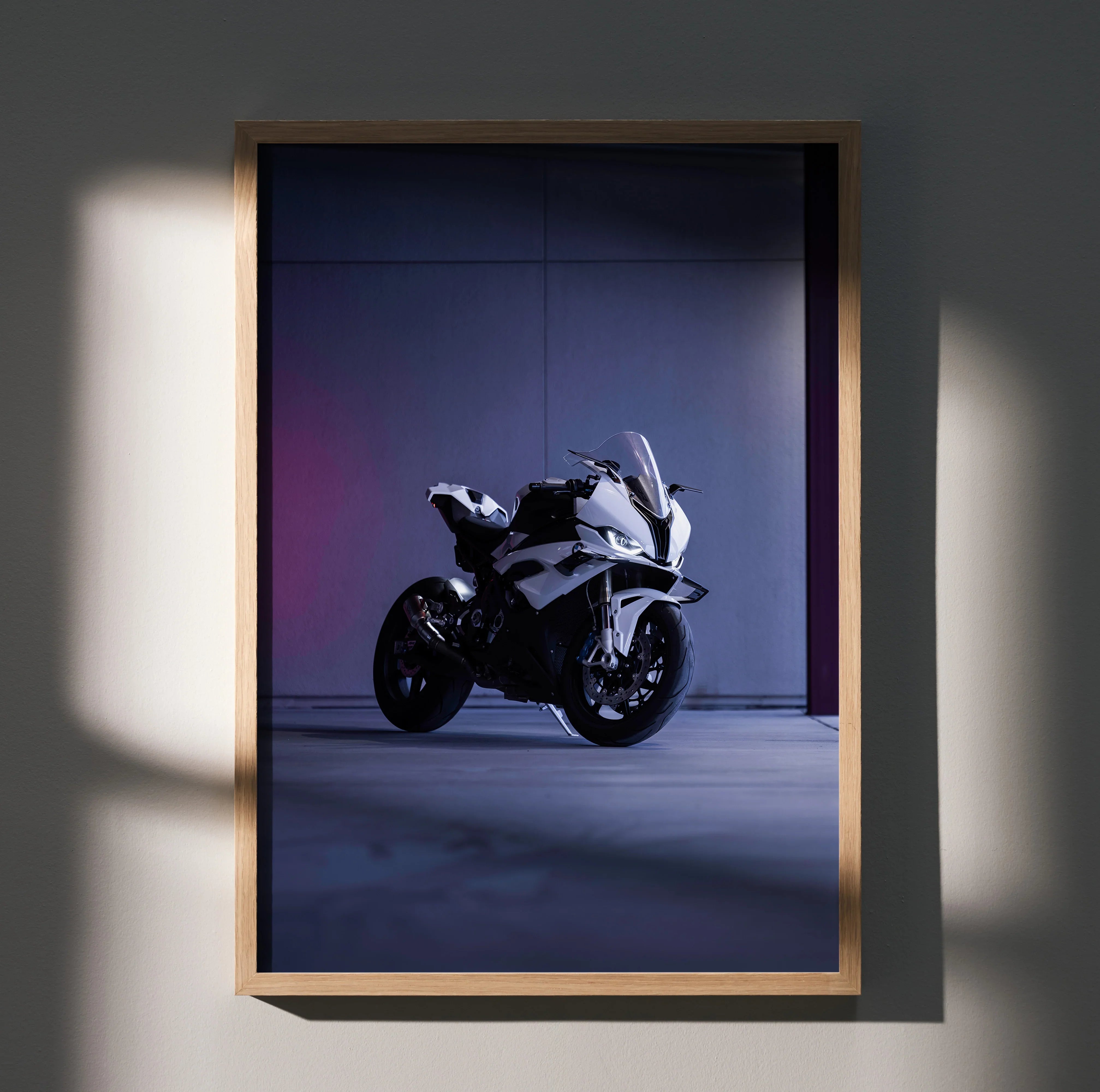 BMW S1000RR motorcycle poster wall art with sleek white bike on dark moody background.