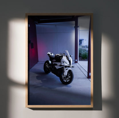 BMW S1000RR motorcycle poster with sleek white bike in dimly lit urban setting wall art.