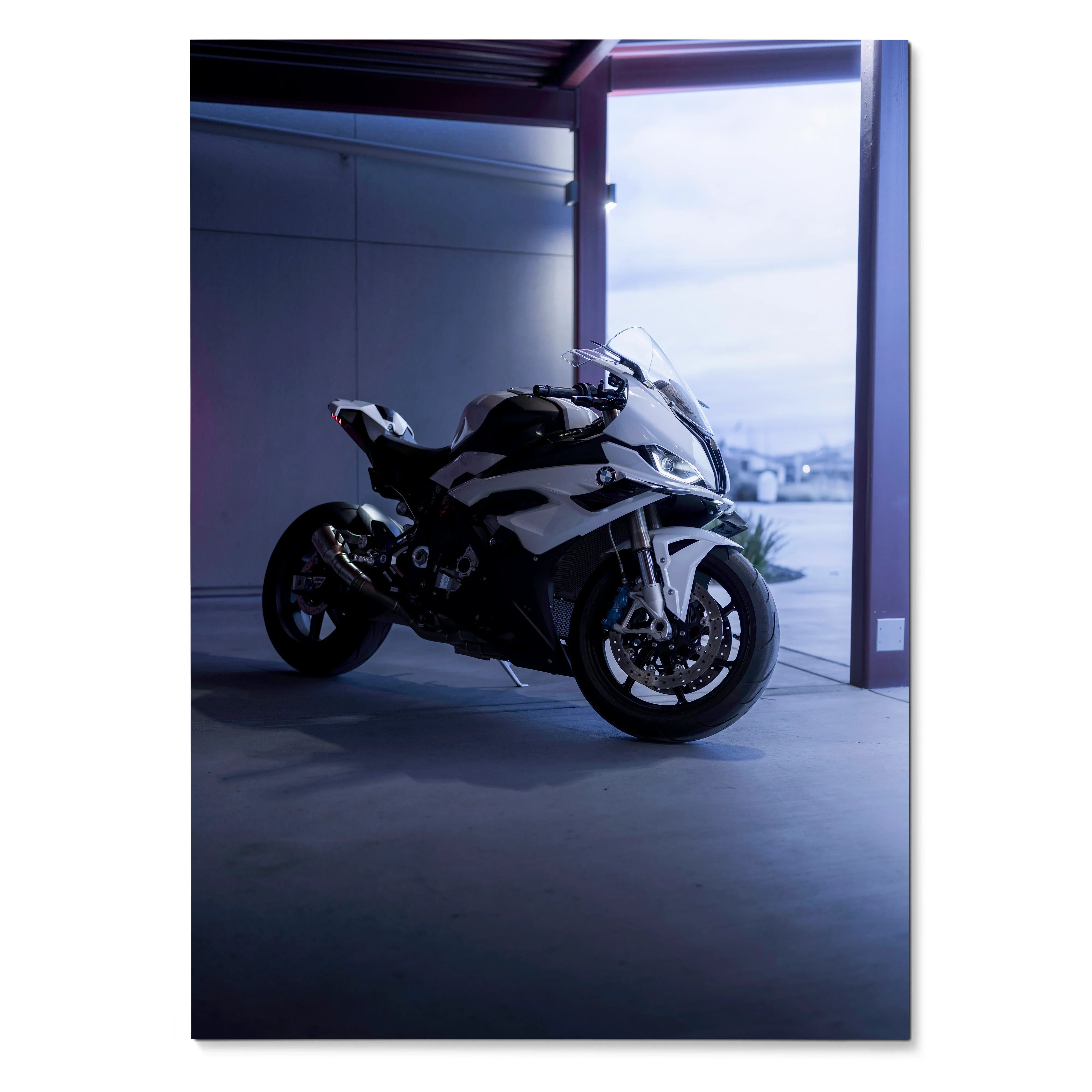 BMW S1000RR motorcycle poster wall art with sleek black and white design in modern garage setting.