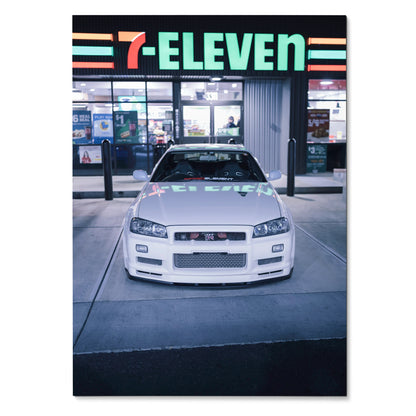 Nissan GTR R34 Skyline poster showing white car front at 7-Eleven autotopia wall art.