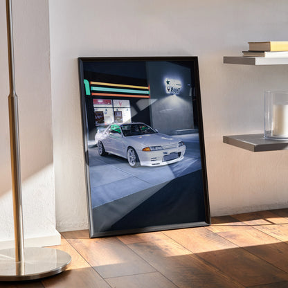 Nissan GTR R32 Skyline vintage car poster in sleek black frame leaning against wall wall art décor.