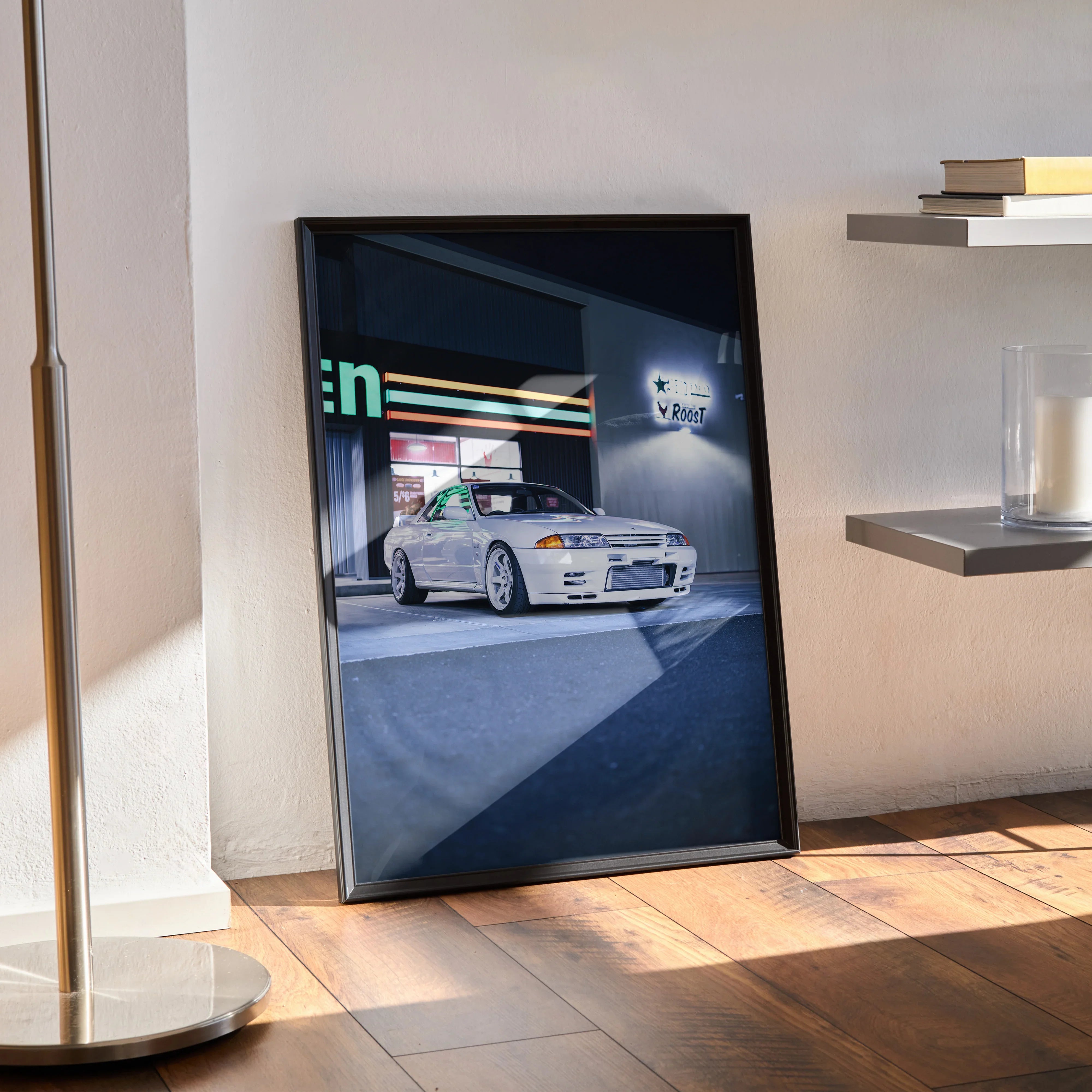 Nissan R32 GTR Poster in sleek black frame displayed on wooden floor with urban night scene Wall Art.