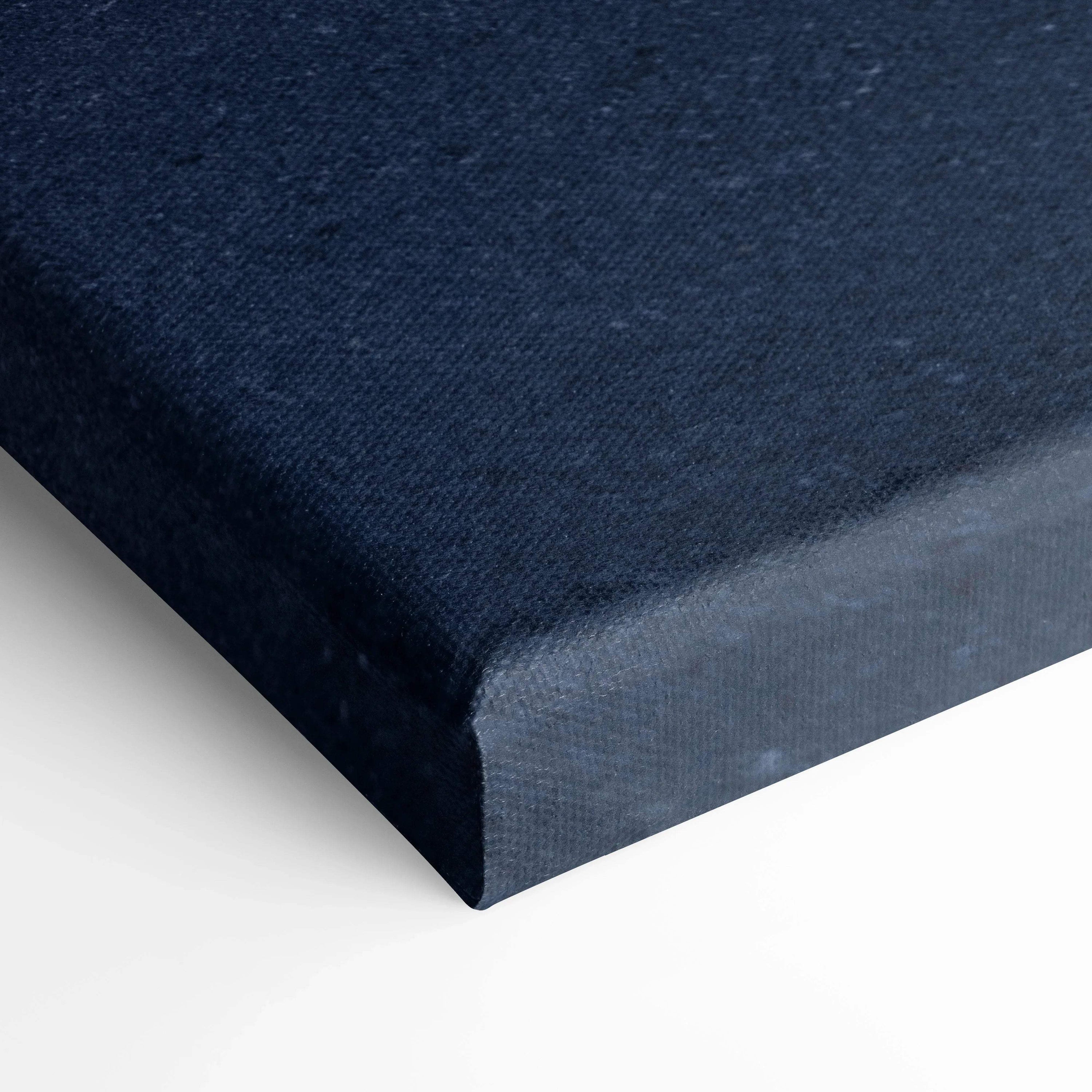 Close-up of navy blue canvas texture on gallery-wrapped vertical wall art canvas print.