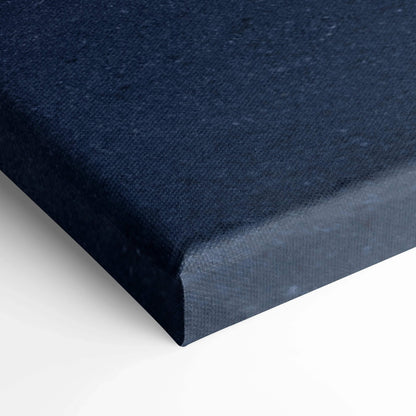 Close-up of navy blue canvas texture on gallery-wrapped vertical wall art canvas print.