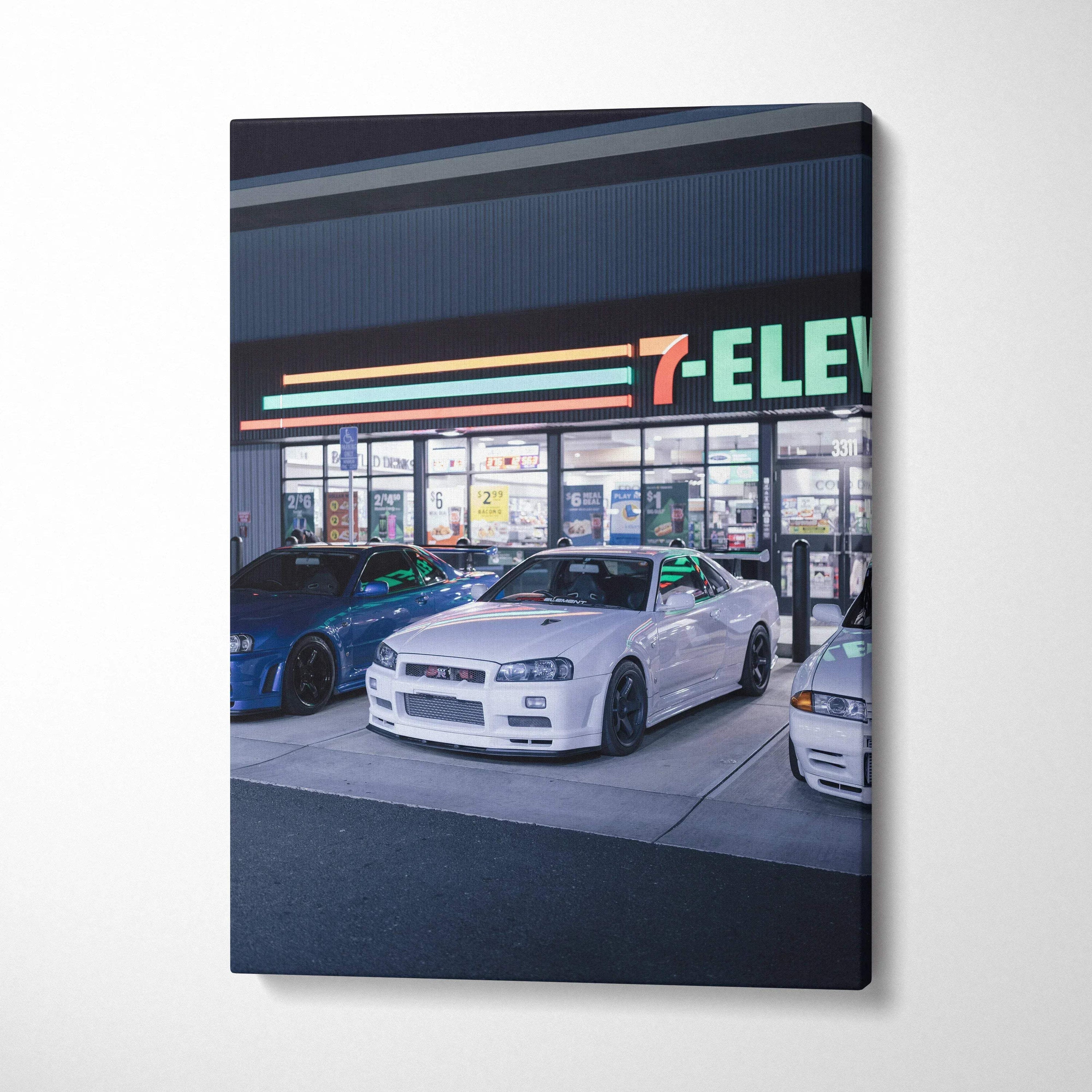 Nissan GTR R34 Skyline parked in front of 7-Eleven at night canvas art wall decor.