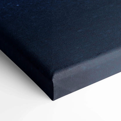 Close-up of black textured canvas wrap with sharp edges for wall art display.
