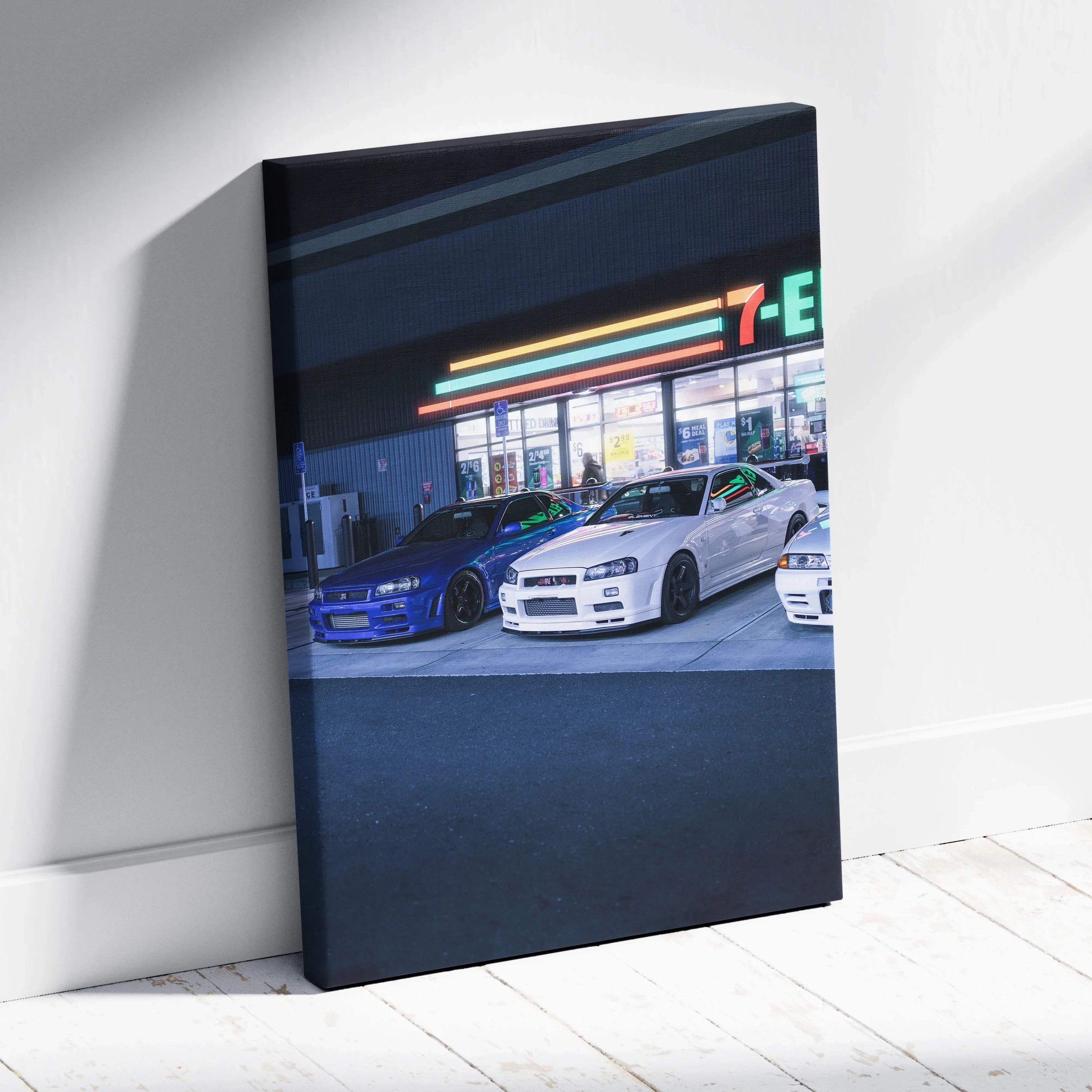 Vertical canvas art of Nissan GTR R34 Skylines parked outside a lit 7-Eleven at night wall art.