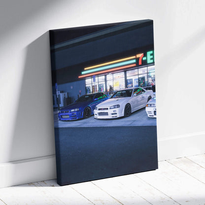 Vertical canvas art of Nissan GTR R34 Skylines parked outside a lit 7-Eleven at night wall art.