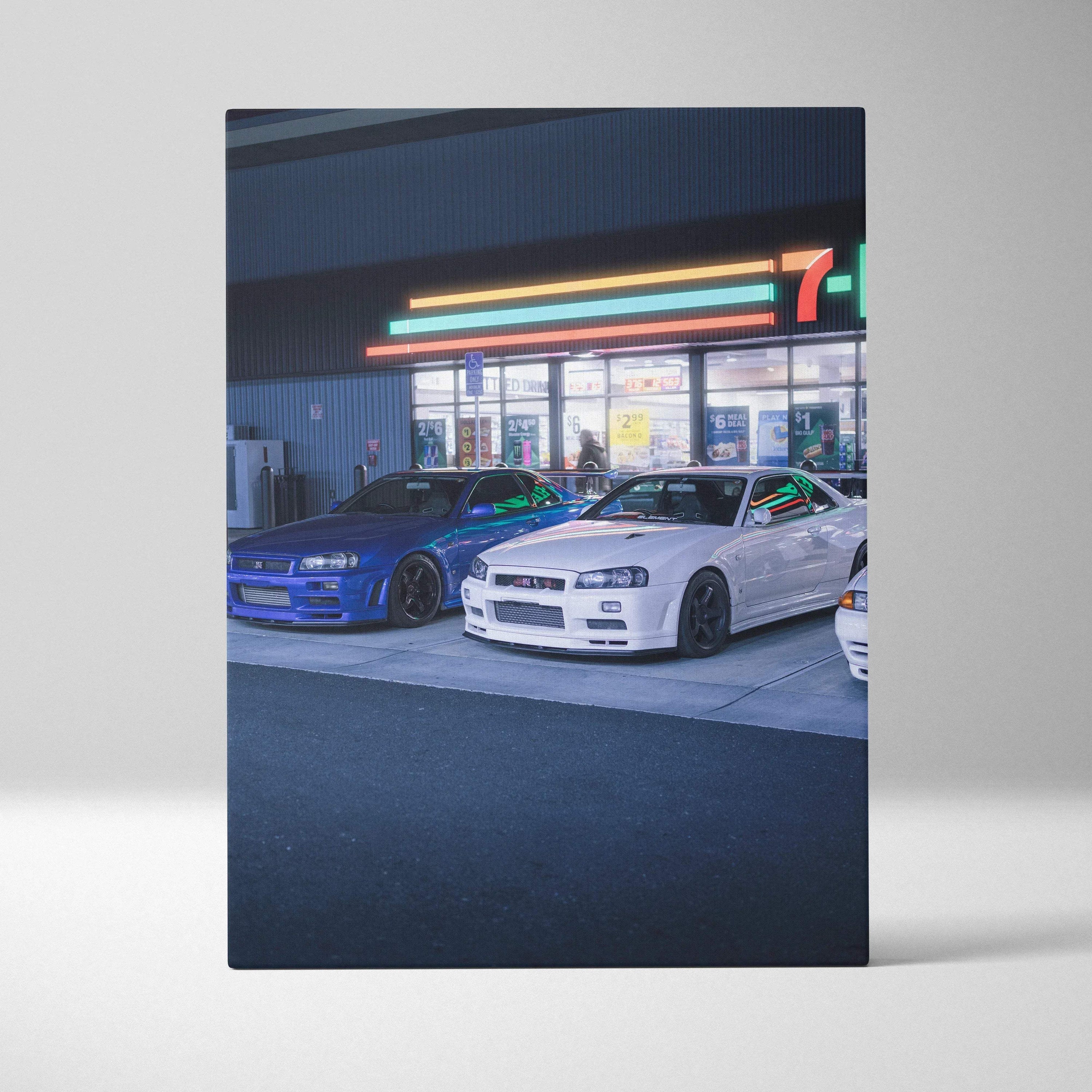 Vertical canvas wall art featuring high-resolution Nissan GTR R34 Skyline cars in front of a 7-Eleven store at night.