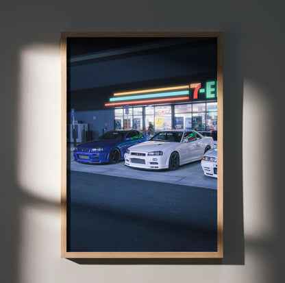 Nissan GTR R34 Skyline poster featuring blue and white cars in front of a 7-Eleven at night wall art.