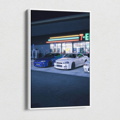 Nissan GTR R34 Skyline canvas art featuring blue and white cars parked in front of a lit convenience store at night,.