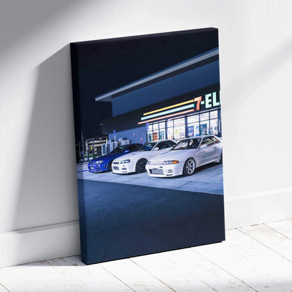 Vertical canvas wall art featuring Nissan GTR R34 Skyline cars parked outside a convenience store at night.
