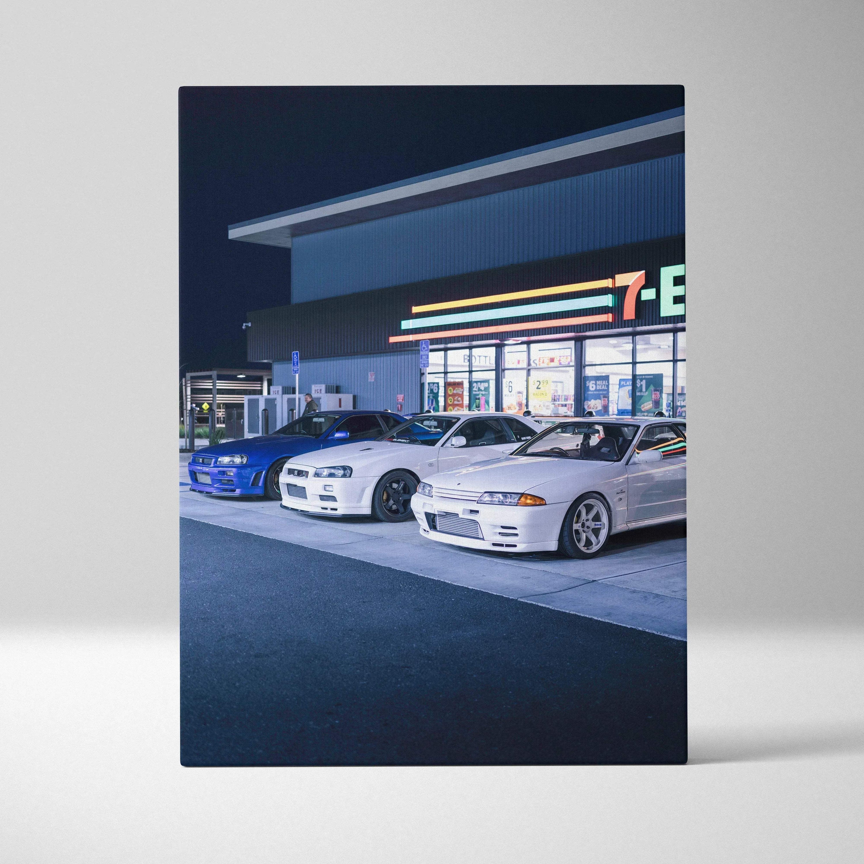 Nissan GTR R34 Skyline canvas art featuring blue, white, and silver cars outside 7-Eleven wall art.