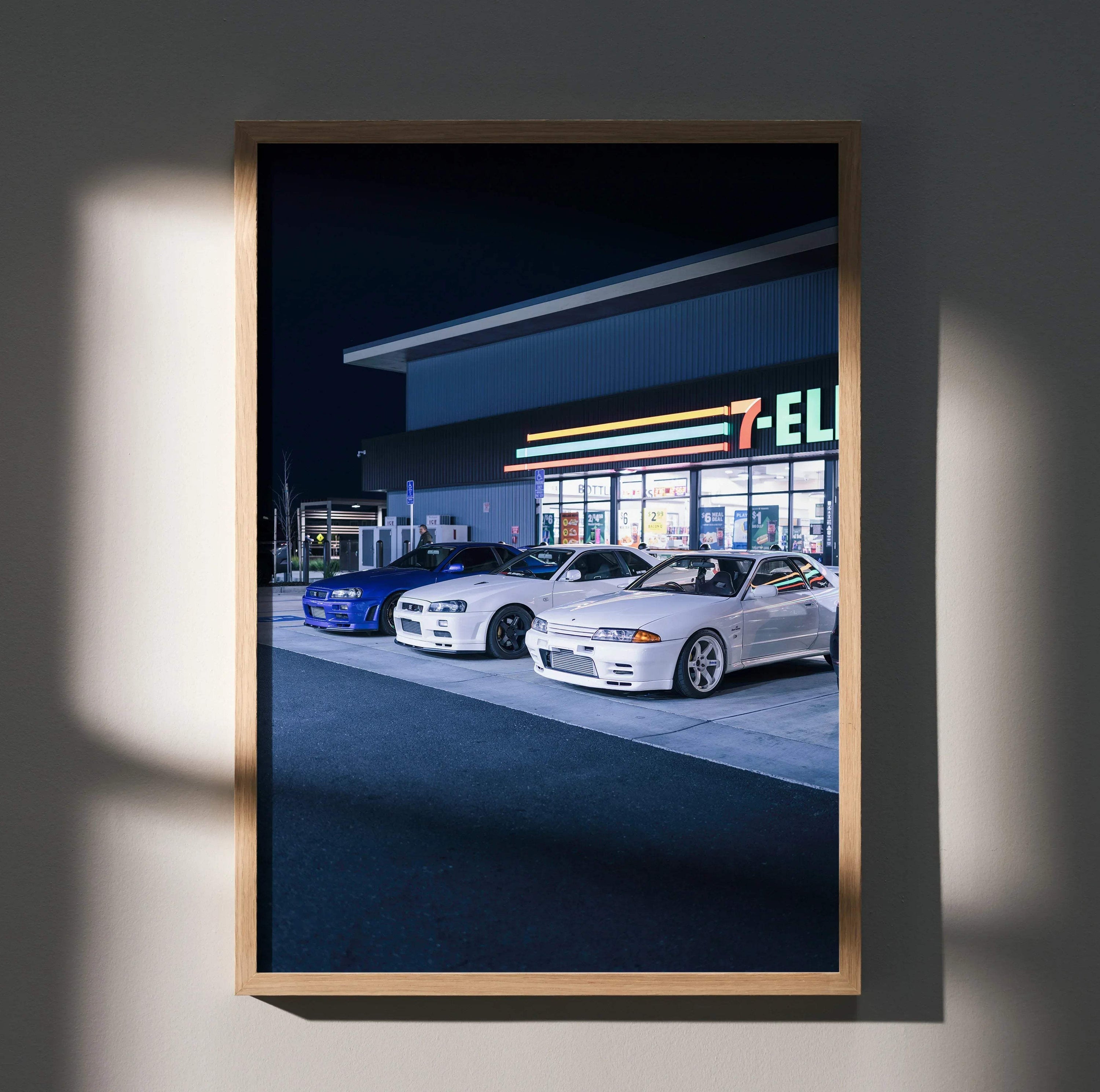 Nissan GTR R32 and R34 Skyline white and blue cars parked at gas station poster wall art.
