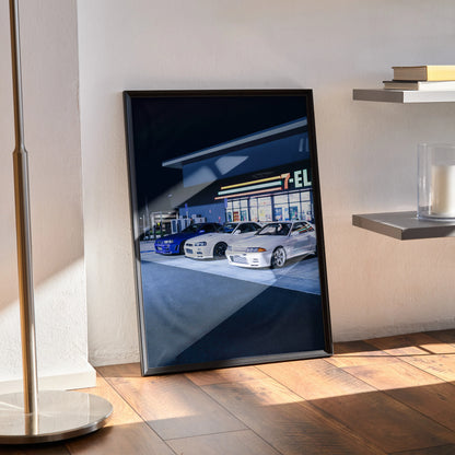 Nissan GTR R32 and R34 Skyline poster wall art with nighttime garage scene in sleek black frame.