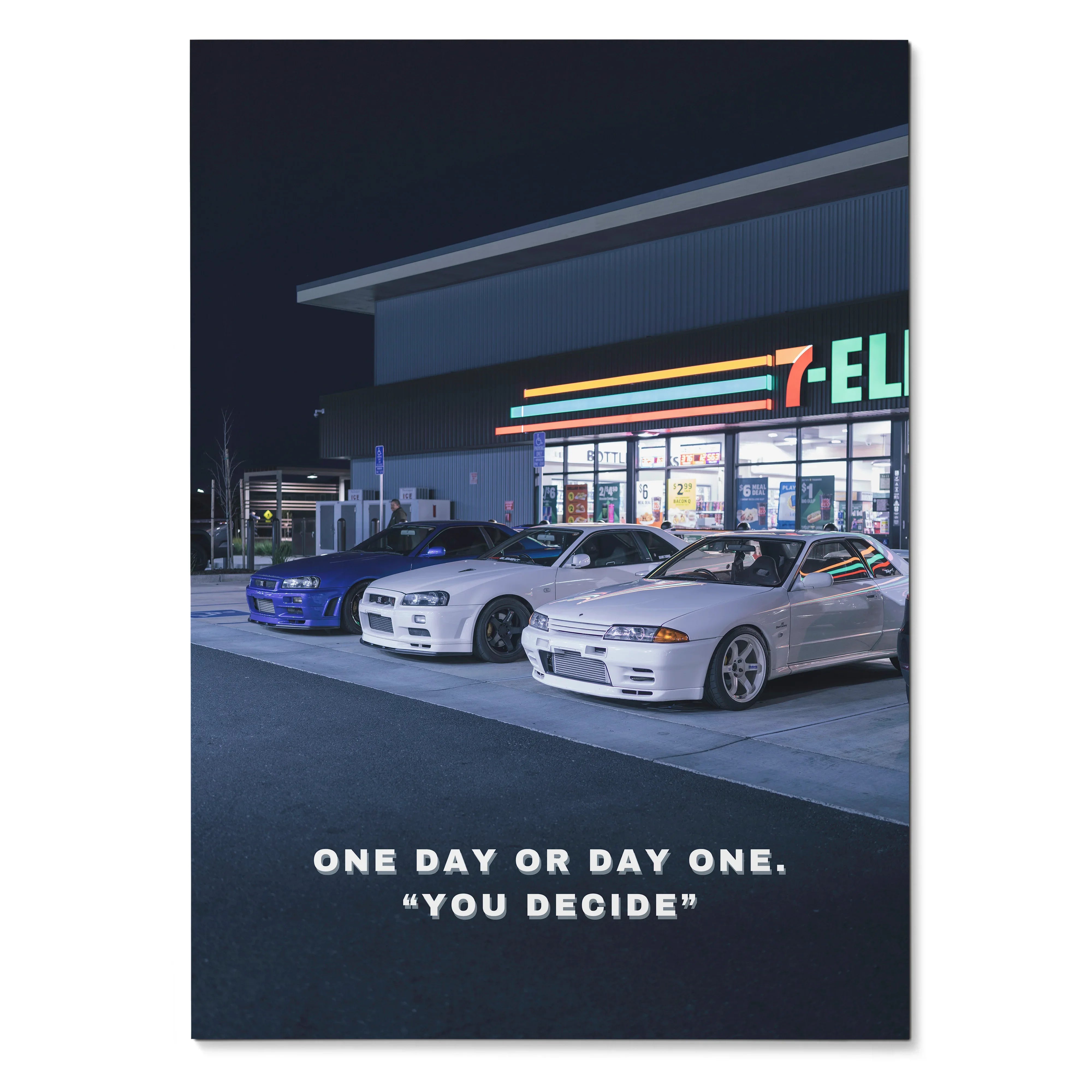 Poster wall art featuring three Nissan GT-R R34 Skylines parked outside a 7-Eleven at night with the quote "One day or day.