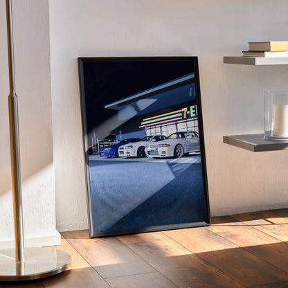 Nissan GTR Skyline R32 and R34 legends poster with high-resolution car art in black frame on wooden floor wall art.