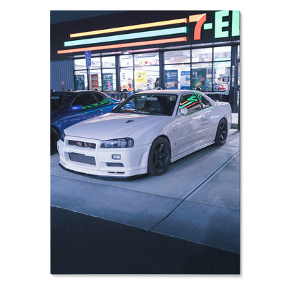 Nissan GTR R34 Skyline white sports car parked at night poster wall art.