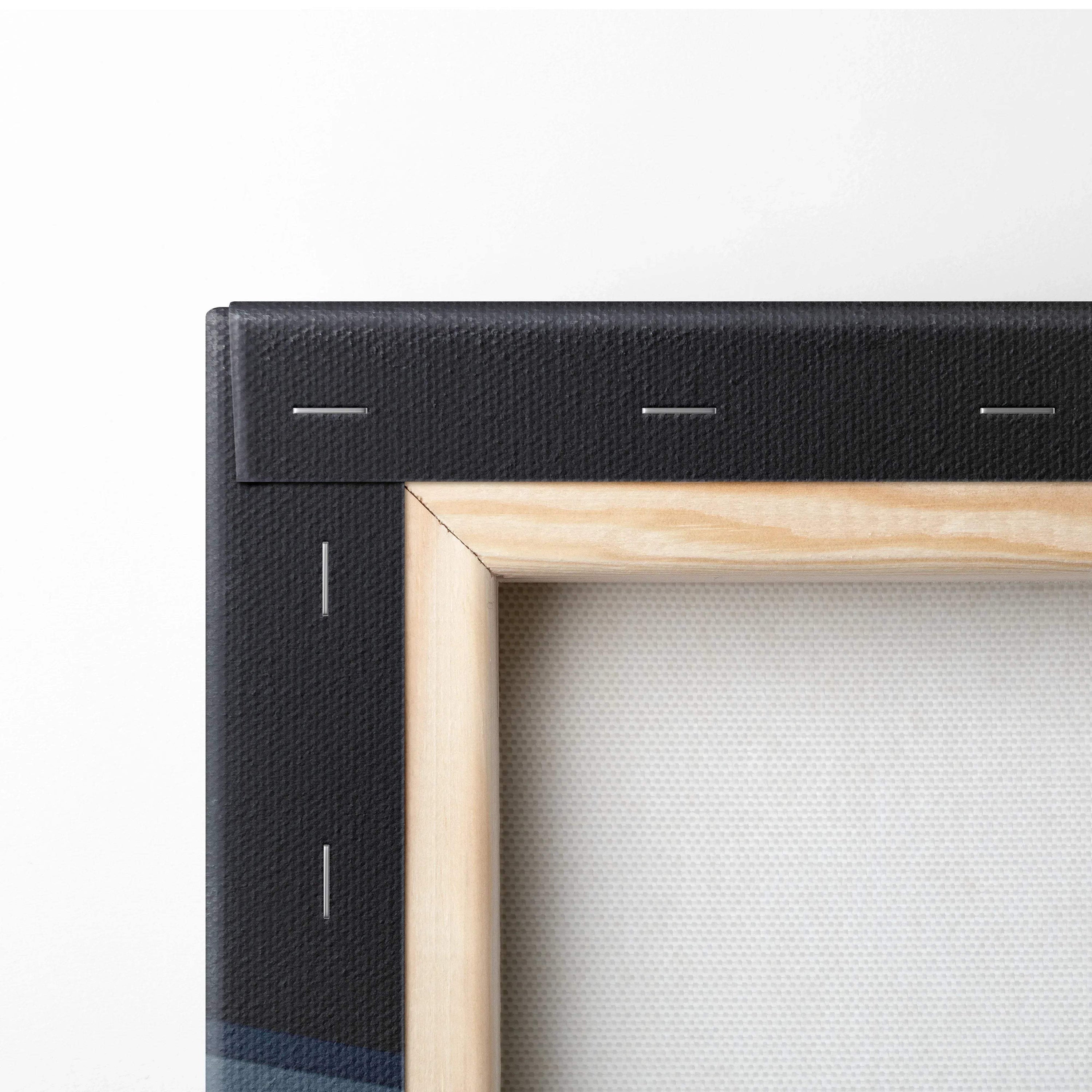 Close-up of wooden frame and black canvas edge showing texture and stretched canvas for wall art canvas print.
