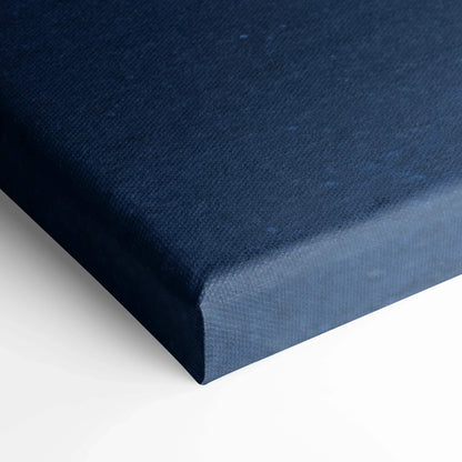 Close-up of navy blue canvas edge showcasing textured fabric stretched over wooden frame, wall art canvas detail.