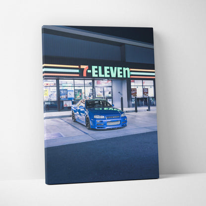 Nissan GTR R34 Skyline blue car parked under 7-Eleven sign canvas wall art.