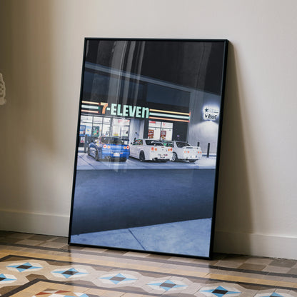 Nissan GTR R32 and R34 Skyline art poster leaning against wall with 7-Eleven background, automotive wall art.