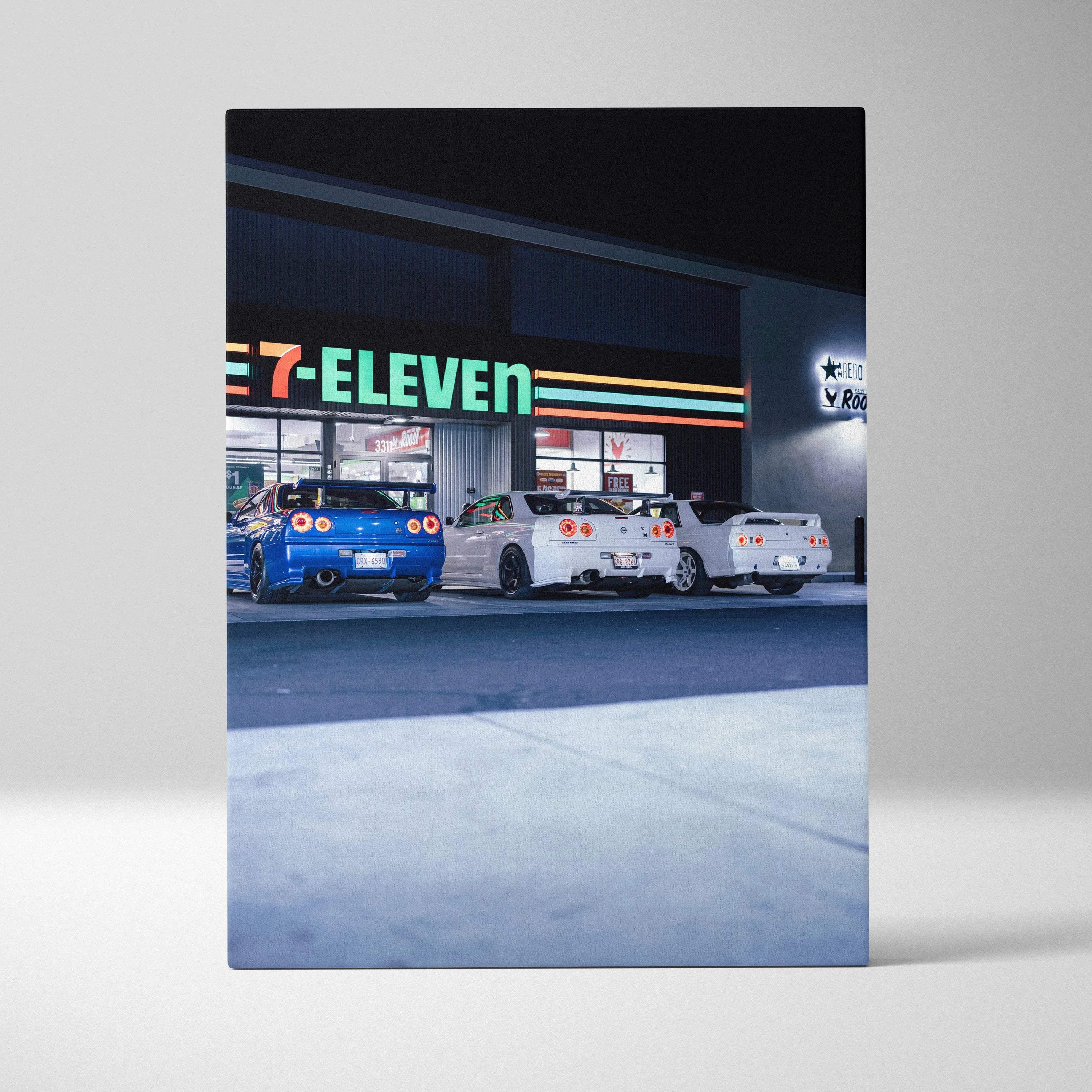 Vertical canvas art featuring three Nissan GTR R34 Skylines parked outside a 7-Eleven at night, wall art with vivid car and.