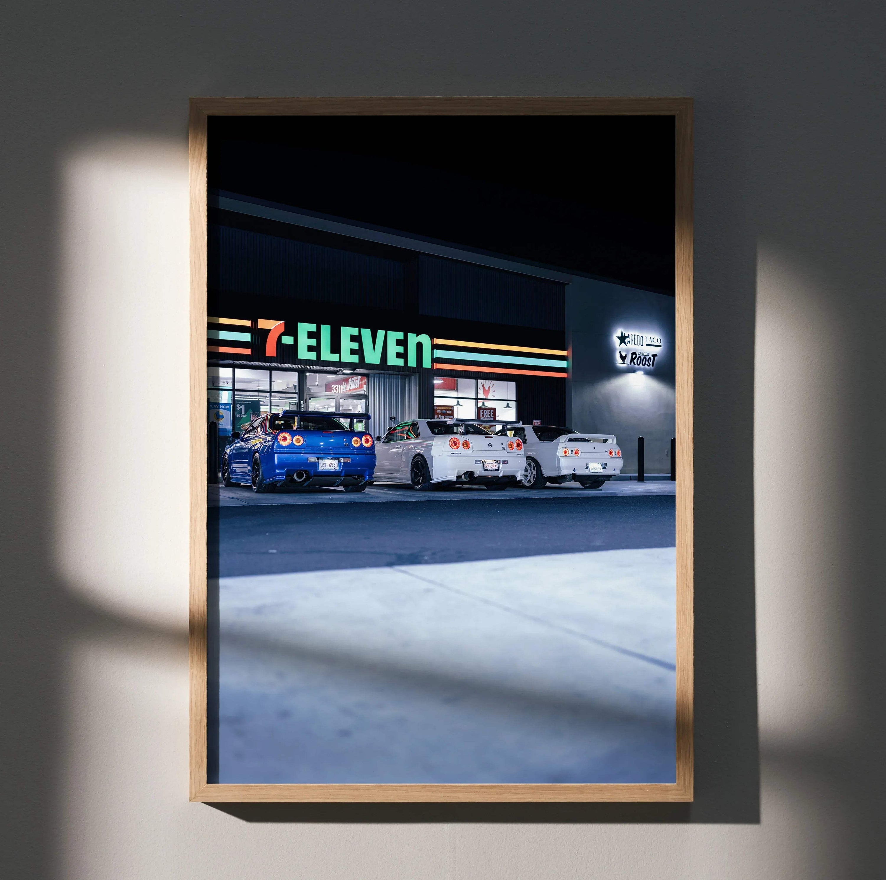 Nissan GTR R32 and R34 Skyline parked outside 7-Eleven at night poster wall art.
