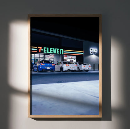 Nissan GTR R32 and R34 Skyline parked outside 7-Eleven at night poster wall art.