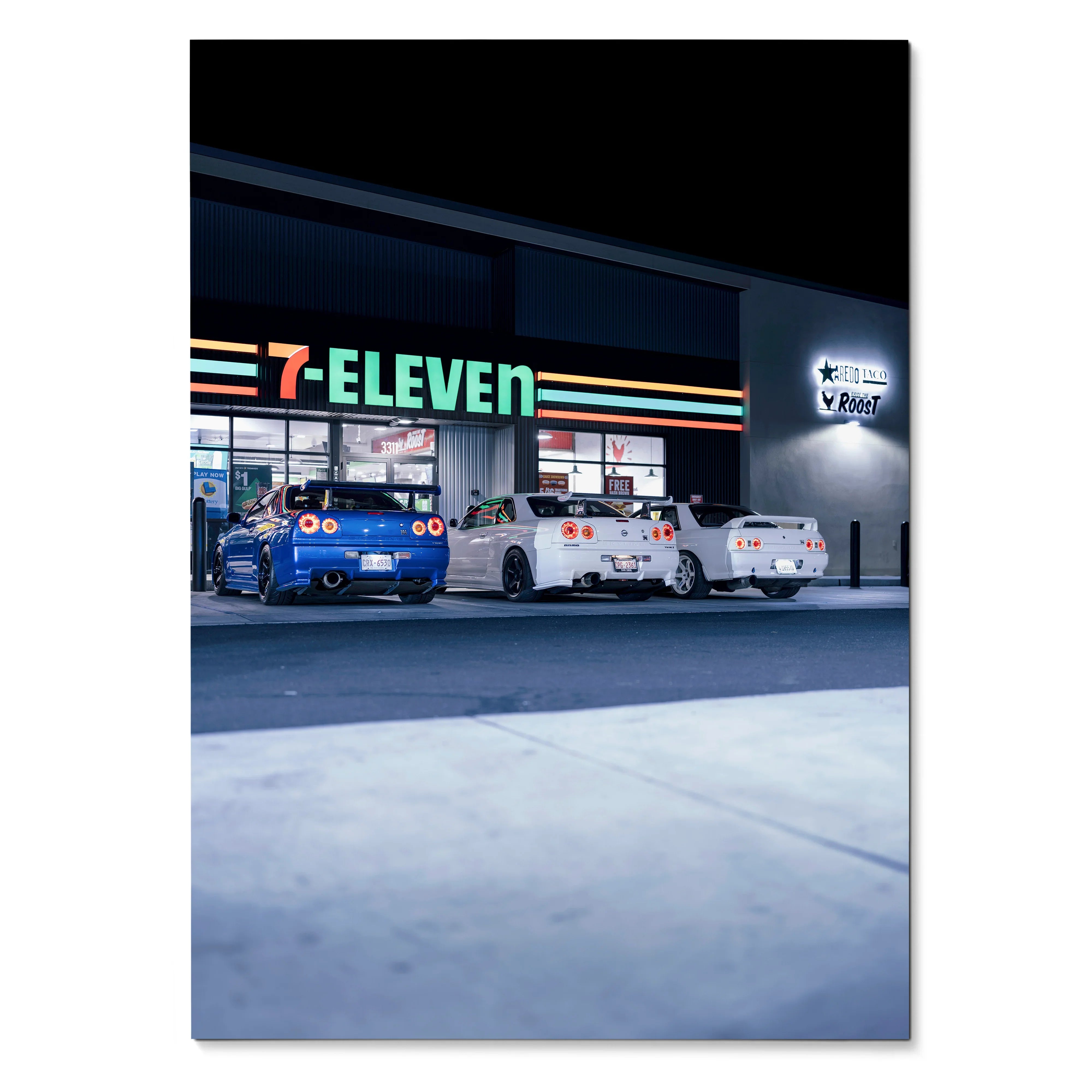 Nissan GTR R32 and R34 Skyline cars parked outside 7-Eleven at night wall art poster.