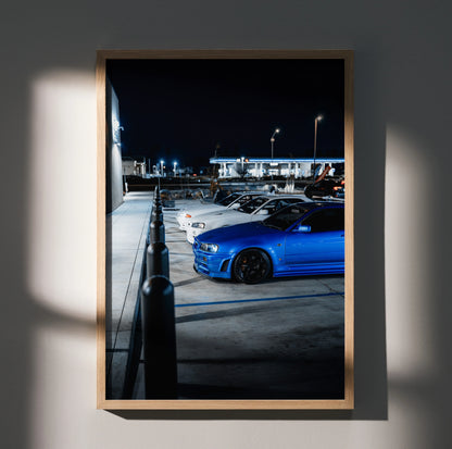 Nissan GTR Skyline Legends poster featuring blue R32 and white R34 GTRs in nighttime parking lot wall art.