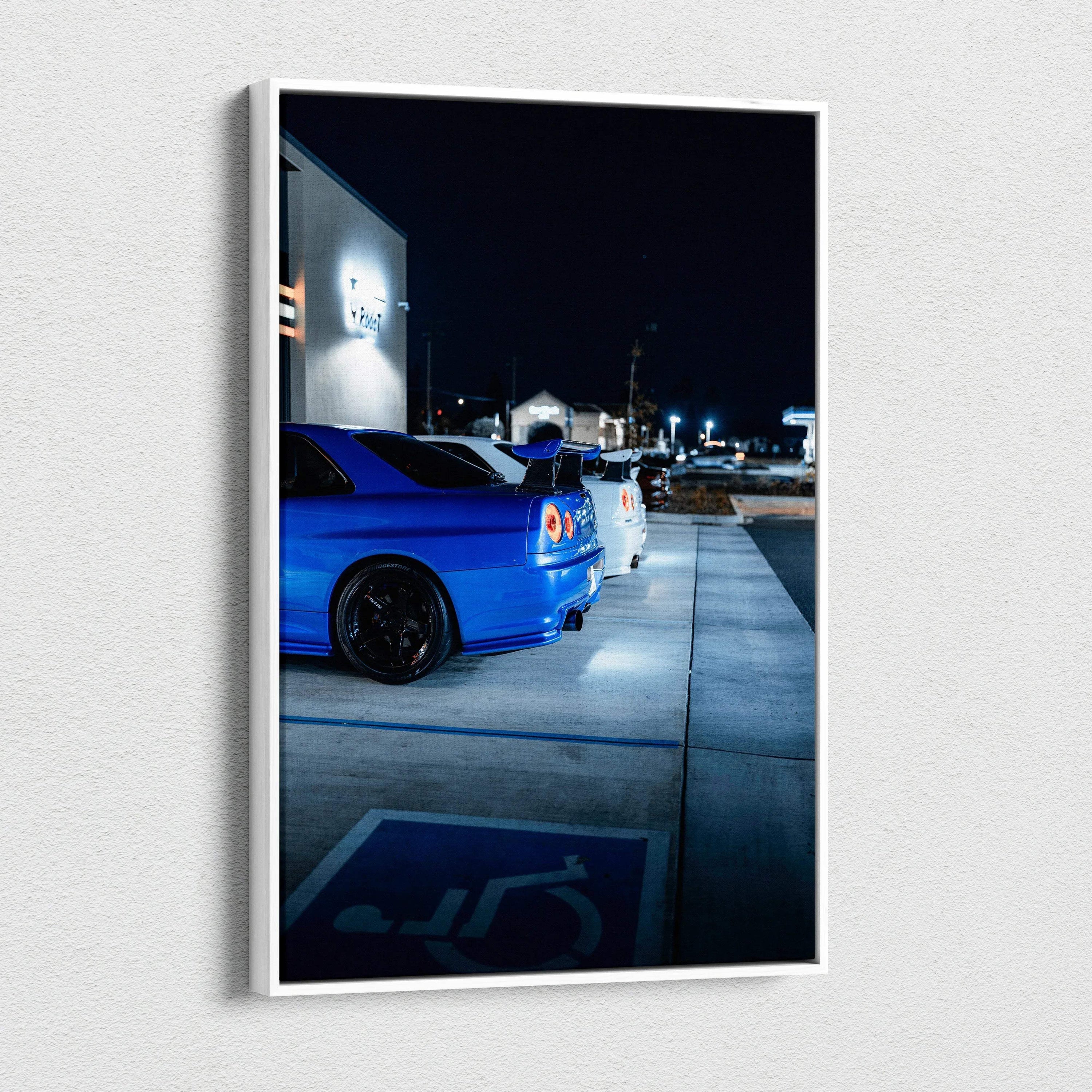 Vertical canvas art featuring a blue Nissan GTR R34 Skyline parked at night, high-resolution wall art.