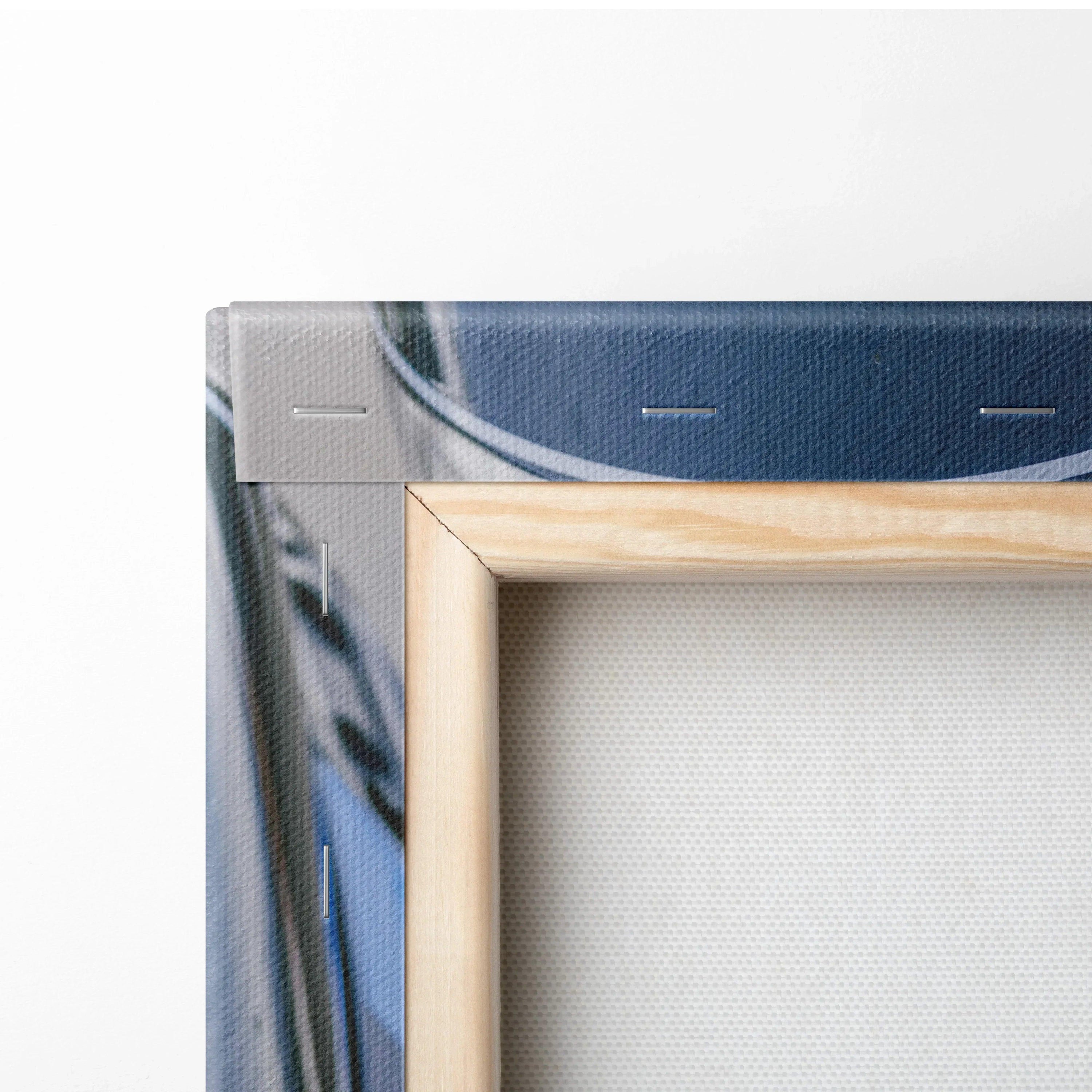 Close-up of wooden frame and stretched canvas corner showing textured BMW M1000RR motorcycle wall art canvas print.