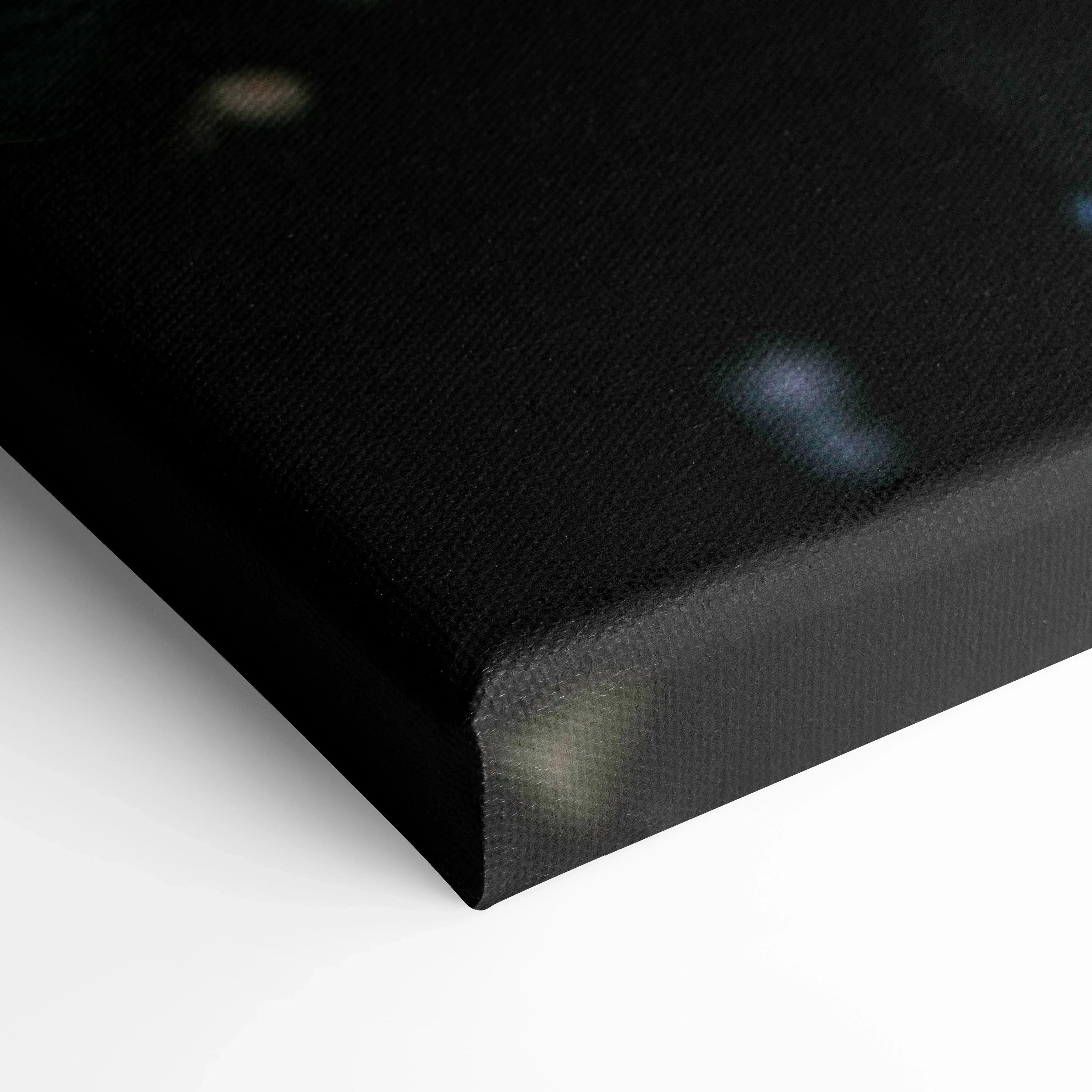 Close-up of black wrapped edge canvas print showcasing textured weave for wall art display.