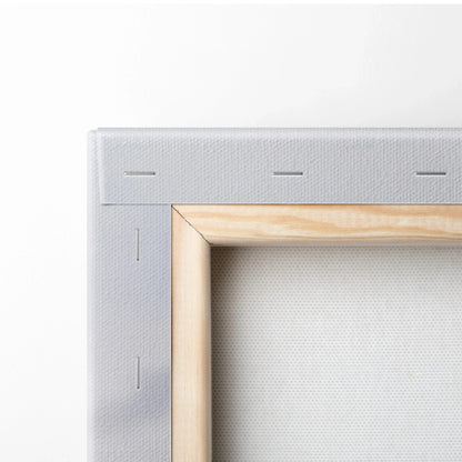 Close-up of white stretched canvas art on wooden frame corner for wall art display.