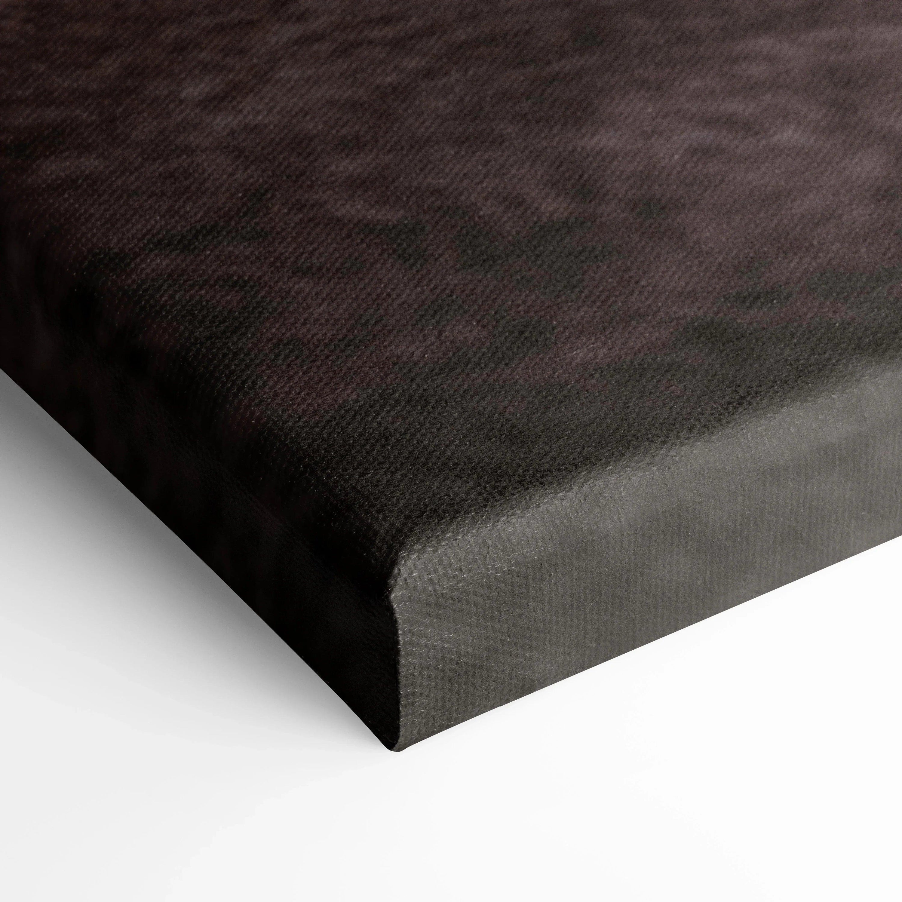 Close-up of black textured canvas corner showing high-quality wall art material and edge wrap detail.