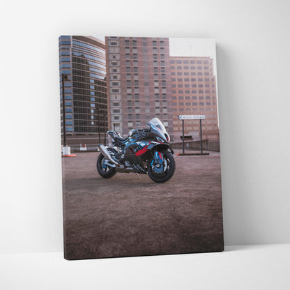 BMW M1000RR motorcycle vertical canvas art with urban skyline background, high-resolution wall art.